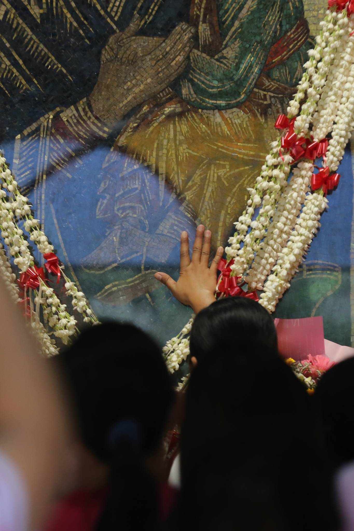 Catholic devotees offer candles and prayers at the Baclaran Church in Paranaque City on 27 June 2026, as the community celebrates the Feast of Mother of Perpetual Help.