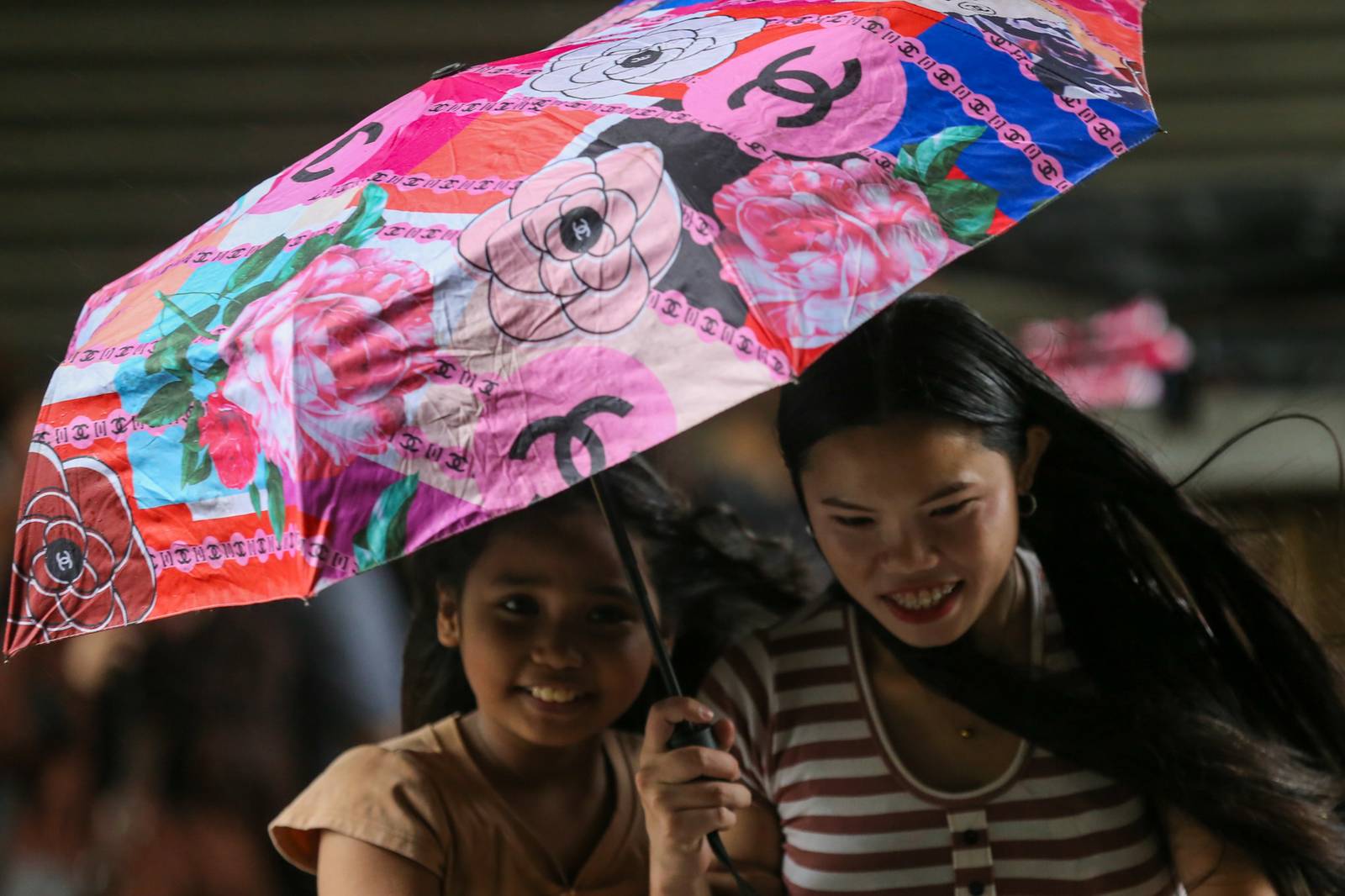 Umbrellas and raincoats are out along Soler Street in Manila on 27 June 2026 as the southwest monsoon, or "Habagat," and the Intertropical Convergence Zone (ITCZ) bring rains across several parts of the country. According to PAGASA, Habagat is expected to bring cloudy skies with scattered rain showers and thunderstorms over Metro Manila.