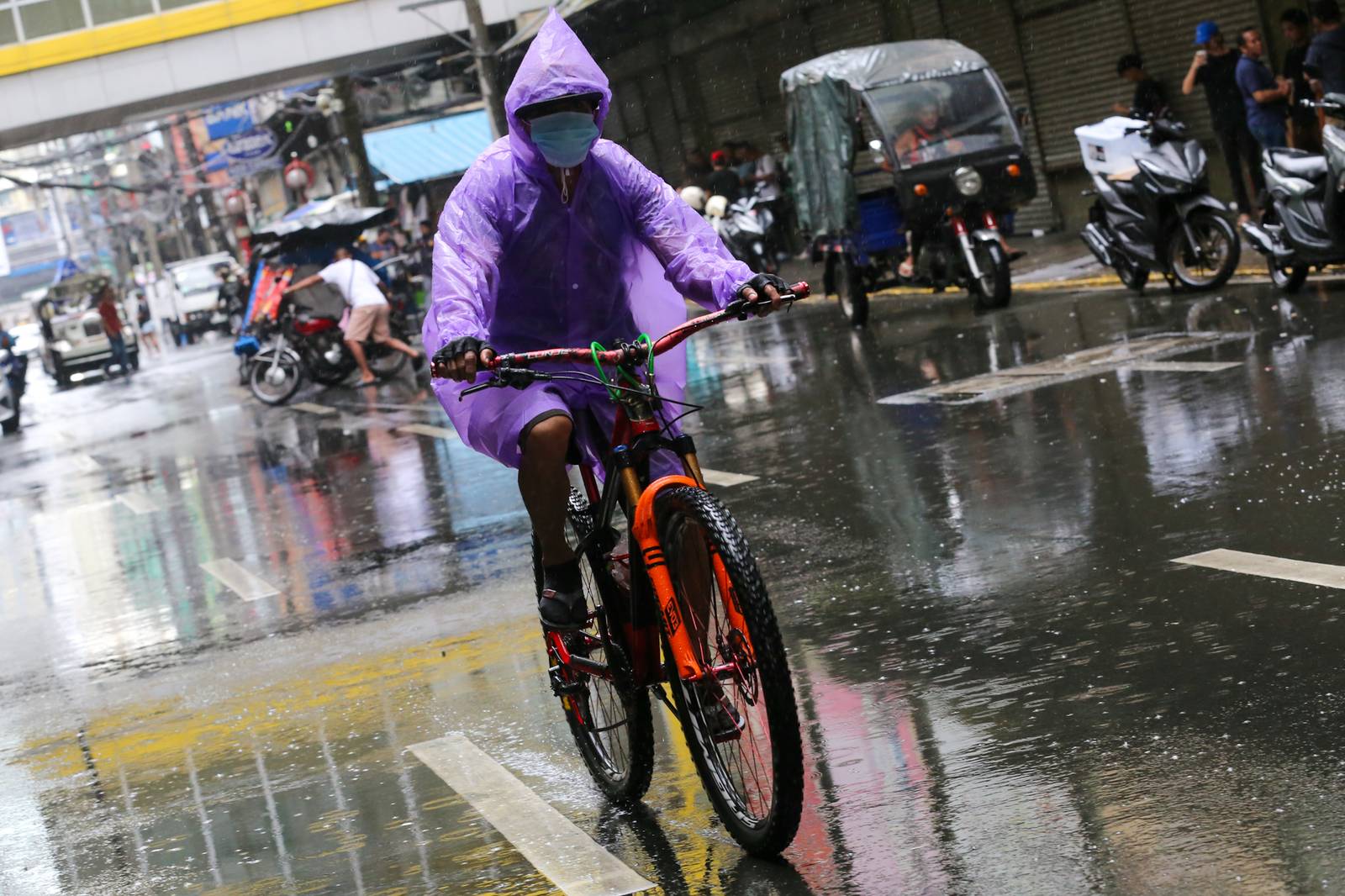Umbrellas and raincoats are out along Soler Street in Manila on 27 June 2026 as the southwest monsoon, or "Habagat," and the Intertropical Convergence Zone (ITCZ) bring rains across several parts of the country. According to PAGASA, Habagat is expected to bring cloudy skies with scattered rain showers and thunderstorms over Metro Manila.