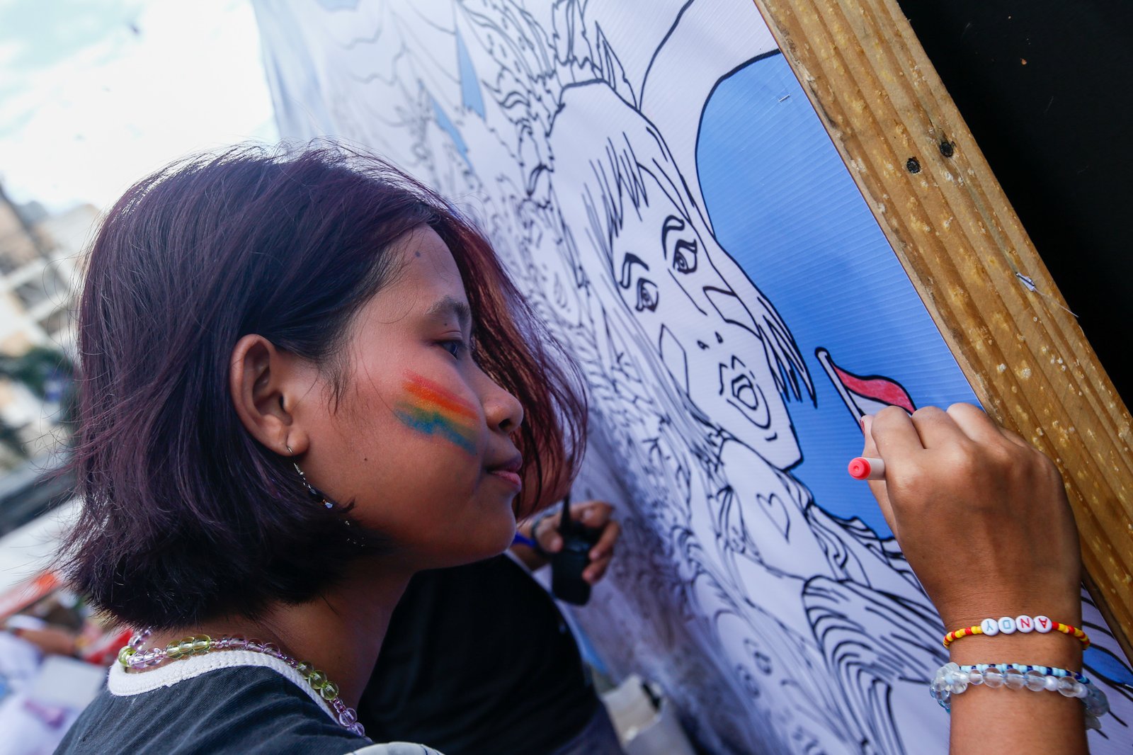 Members of the LGBTQIA+ community and their allies gather at Remedios Circle in Manila on 27 June 2026 during the Metro Pride March and Festival, calling for equality, dignity, justice, and human rights.