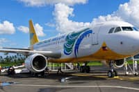 A CEBU Pacific aircraft is seen as ground personnel prepare for flight operations.