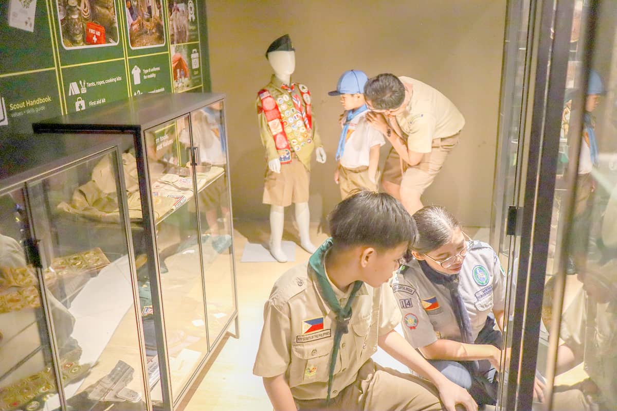A COLLECTION of camping equipment and memorabilia on display.