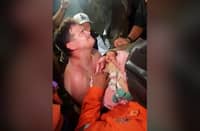 A NEWBORN baby is pulled out alive from the rubble of the city of La Guaira, Venezuela, after twin earthquakes hit the country.