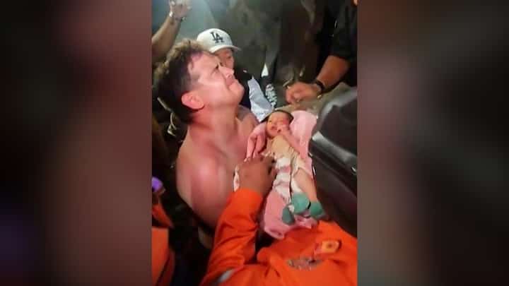 A NEWBORN baby is pulled out alive from the rubble of the city of La Guaira, Venezuela, after twin earthquakes hit the country.