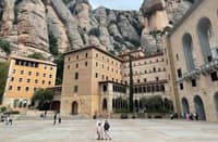 MONTSERRAT'S iconic saw-toothed mountain peaks and panoramic views make it a must-visit, with funiculars providing easy access.
