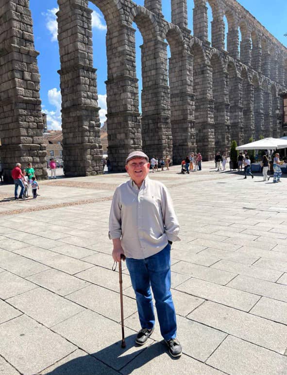 IN front of the historic Roman Aqueduct in Segovia, Spain.