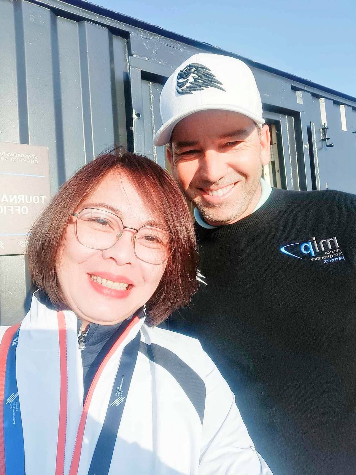 JOCELYN Rodriguez poses with Spanish great Sergio Garcia.