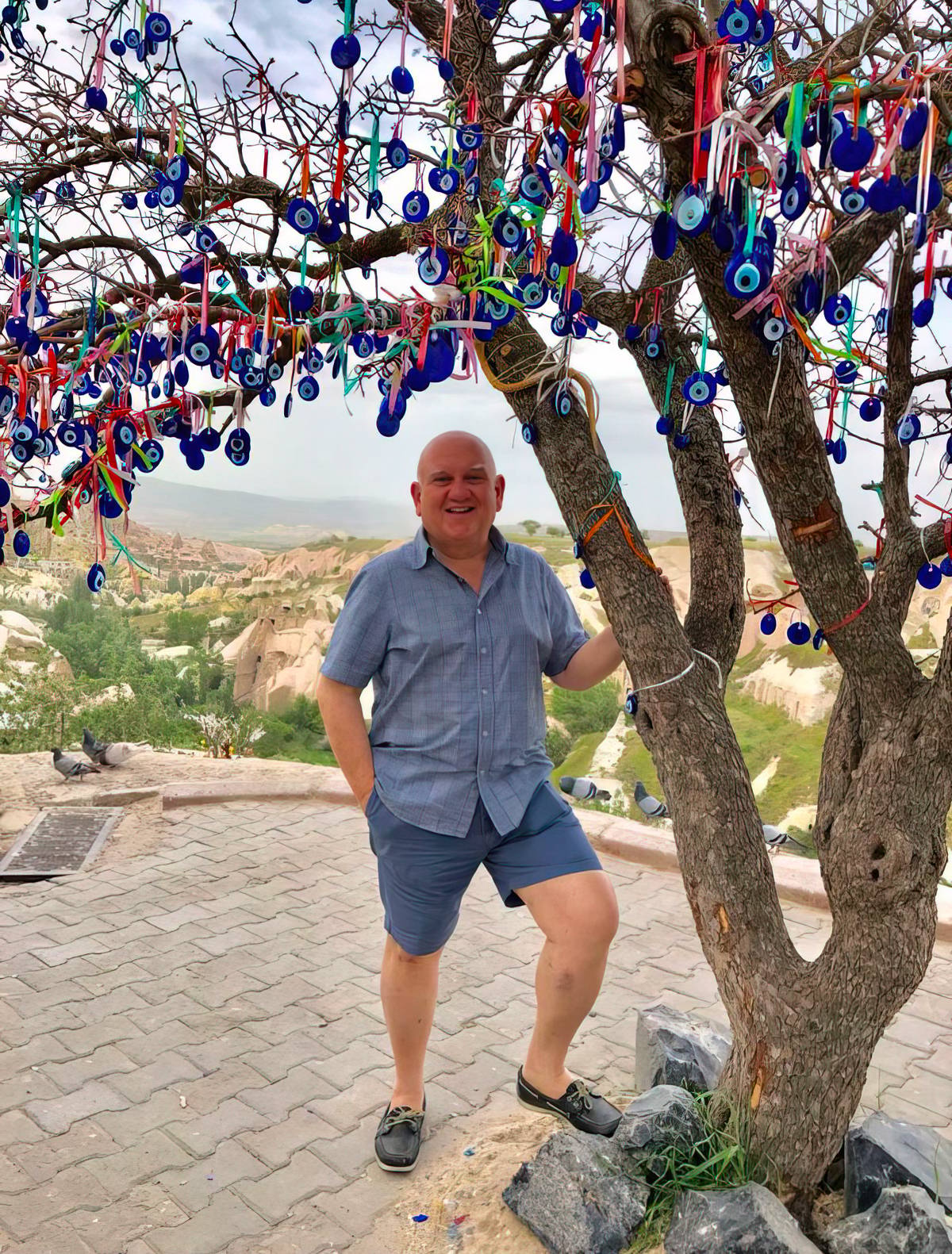 BENEATH a tree decorated with traditional blue nazar (evil eye) charms in Cappadocia, Turkey.