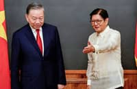 Philippine President Ferdinand Marcos Jr. gestures toward Vietnamese President To Lam during their bilateral meeting at Malacañang Palace in Manila.