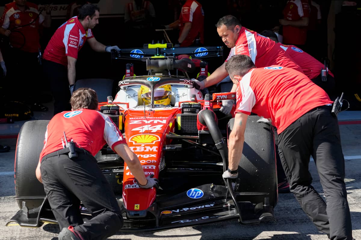 GARAGE-BOUND Lewis Hamilton’s Ferrari is wheeled back into the garage during qualifying for the Formula One Austrian Grand Prix at the Red Bull Ring in Spielberg, Austria, on 27 June 2026, as the British driver looks to build on his recent revival.