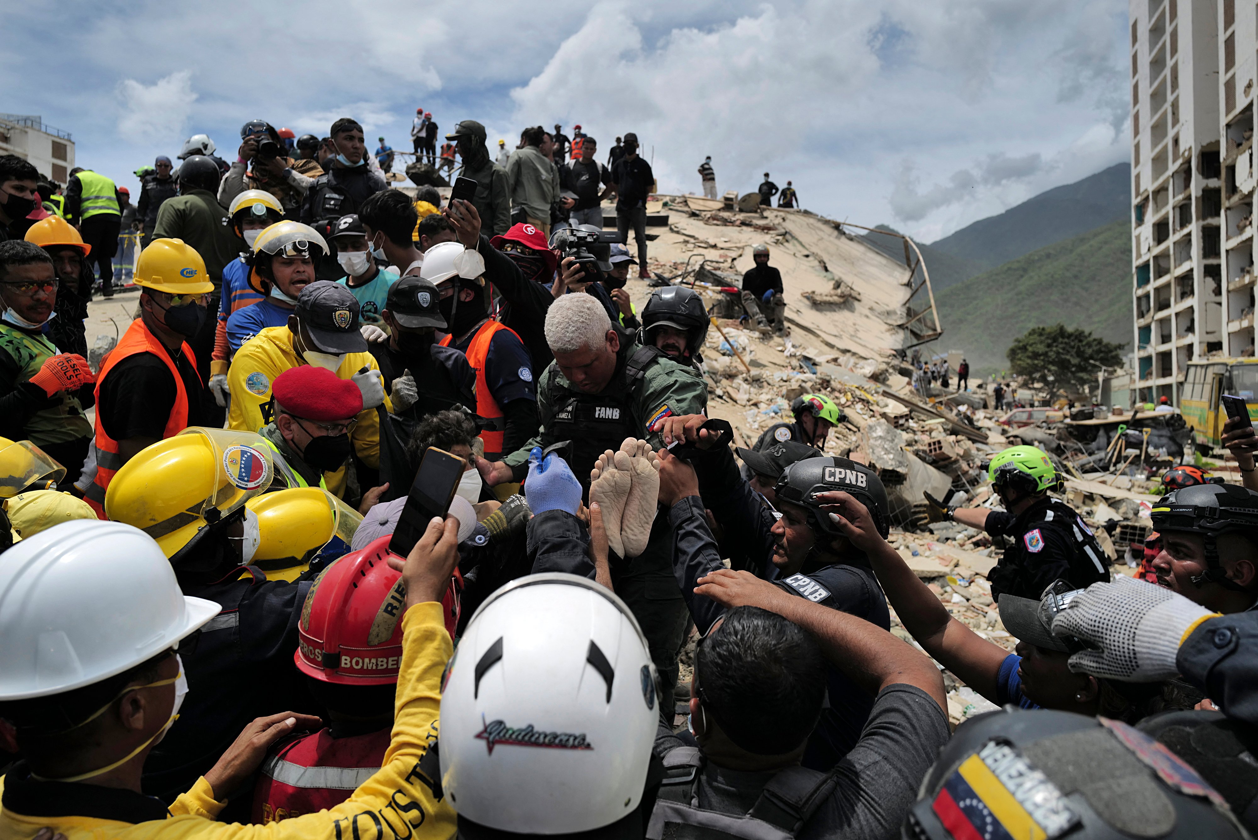 Man, teen son rescued four days after Venezuela quakes