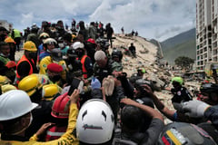 Man, teen son rescued four days after Venezuela quakes