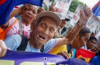 Transport workers and operators stage a demonstration outside the Supreme Court in Manila on Monday. The federation filed a petition urging the high tribunal to halt the implementation of the mandatory public utility vehicle modernization policy.