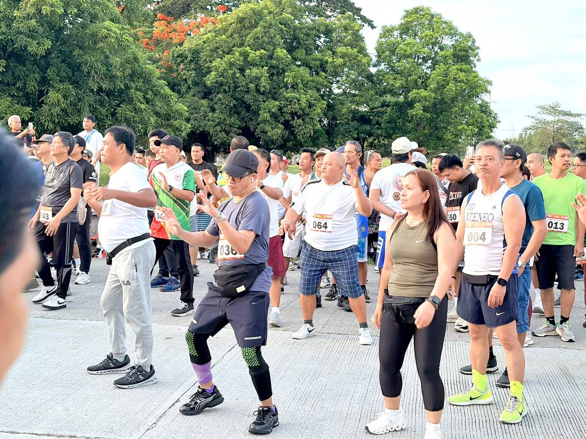 RUNNERS join an energizing zumba session setting the tone for the morning run.