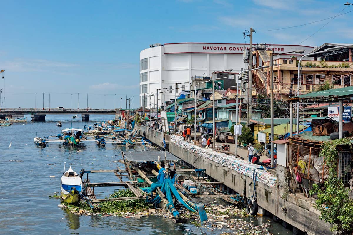 CONSTRUCTION workers from the Department of Public Works and Highways rebuild a section of a seawall damaged by super typhoon ‘Uwan’ in Barangay Bagumbayan South, Navotas City, on 12 November 2025.