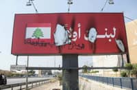 SIGNS reading "Lebanon First" were burned along Beirut's airport road.