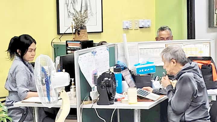 TRIBUNE managing editor Dinah Ventura, business editor Teddy Montelibano, and editor-at-large John Dodson (partly covered) race against time as they pore over stories and make final edits, pushing through deadline pressure to put together the paper’s anniversary issue.