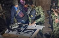 POLICE Regional Office 12 operatives inspect illegal drugs and weapons seized during an intelligence-driven raid in Barangay New Panay, Aleosan, North Cotabato.