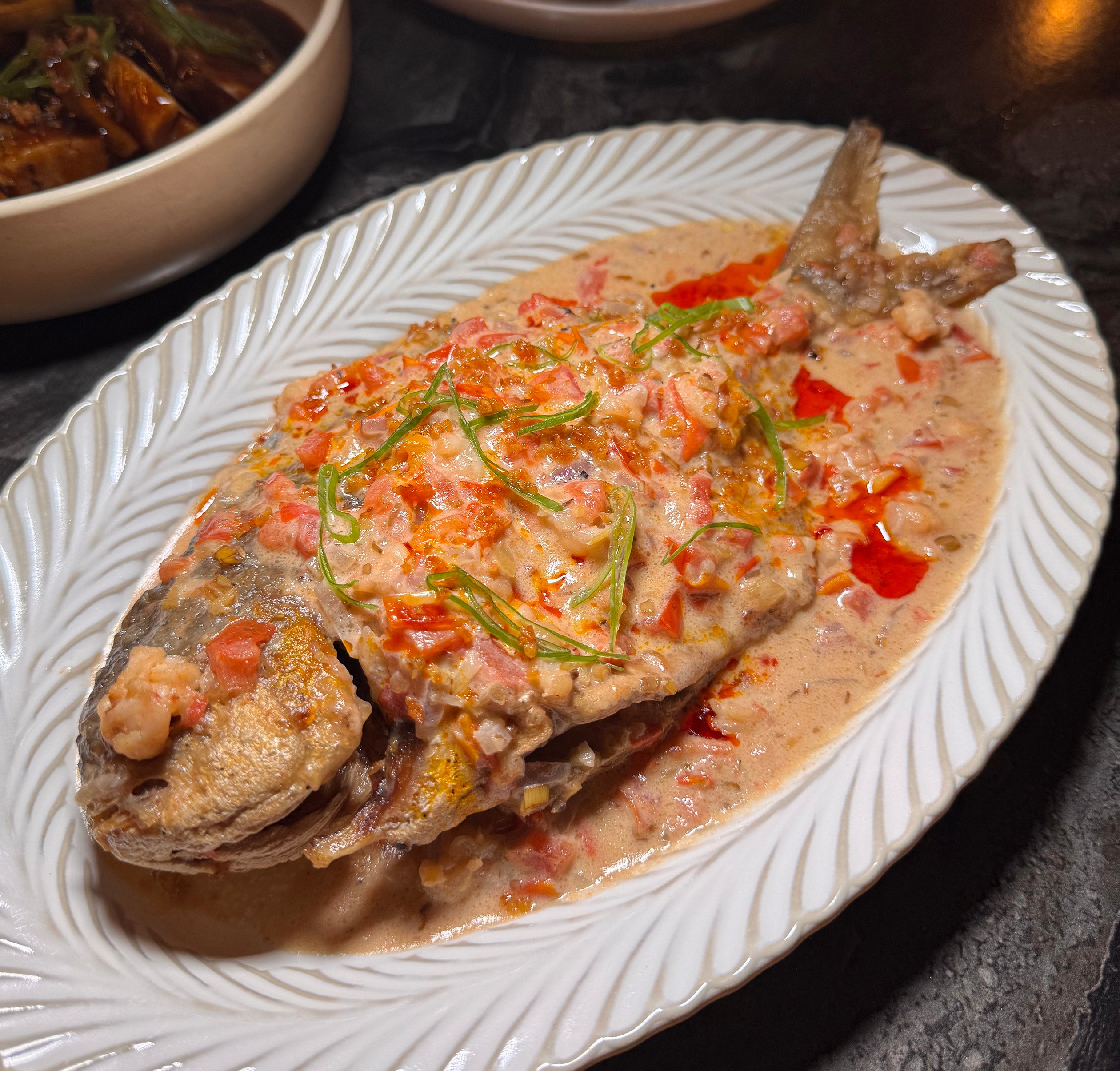 LOLA Juanita’s Whole Pampano Braised in Coconut Milk.