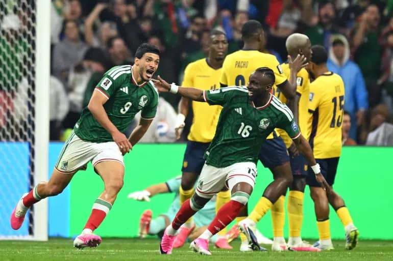 Mexico's forward, number 9 Raul Jimenez, and number 16 Julian Quinones scored to send the co-hosts into the last-16