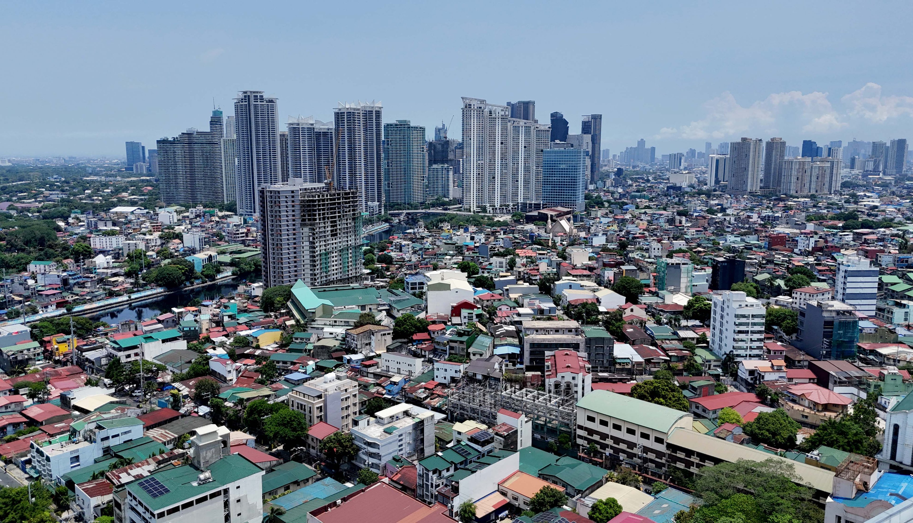 (July 02 2026) A view of the buildings of Taguig and Makati were seen from Mndaluyong City. The World Bank Group's latest country income classifications, released July 1, moved the Philippines from lower-middle-income to upper-middle-income status based on 2025 gross national income per capita estimates. The nation achieved this status after its Gross National Income (GNI) per capita reached $4,850, exceeding the $4,636 threshold for this income bracket.  Under the updated thresholds, upper-middle-income economies are those with GNI per capita of $4,636 to $14,375. Lower-middle-income economies are those with GNI per capita of $1,176 to $4,635, while high-income economies are those above $14,375. Photo/Analy Labor