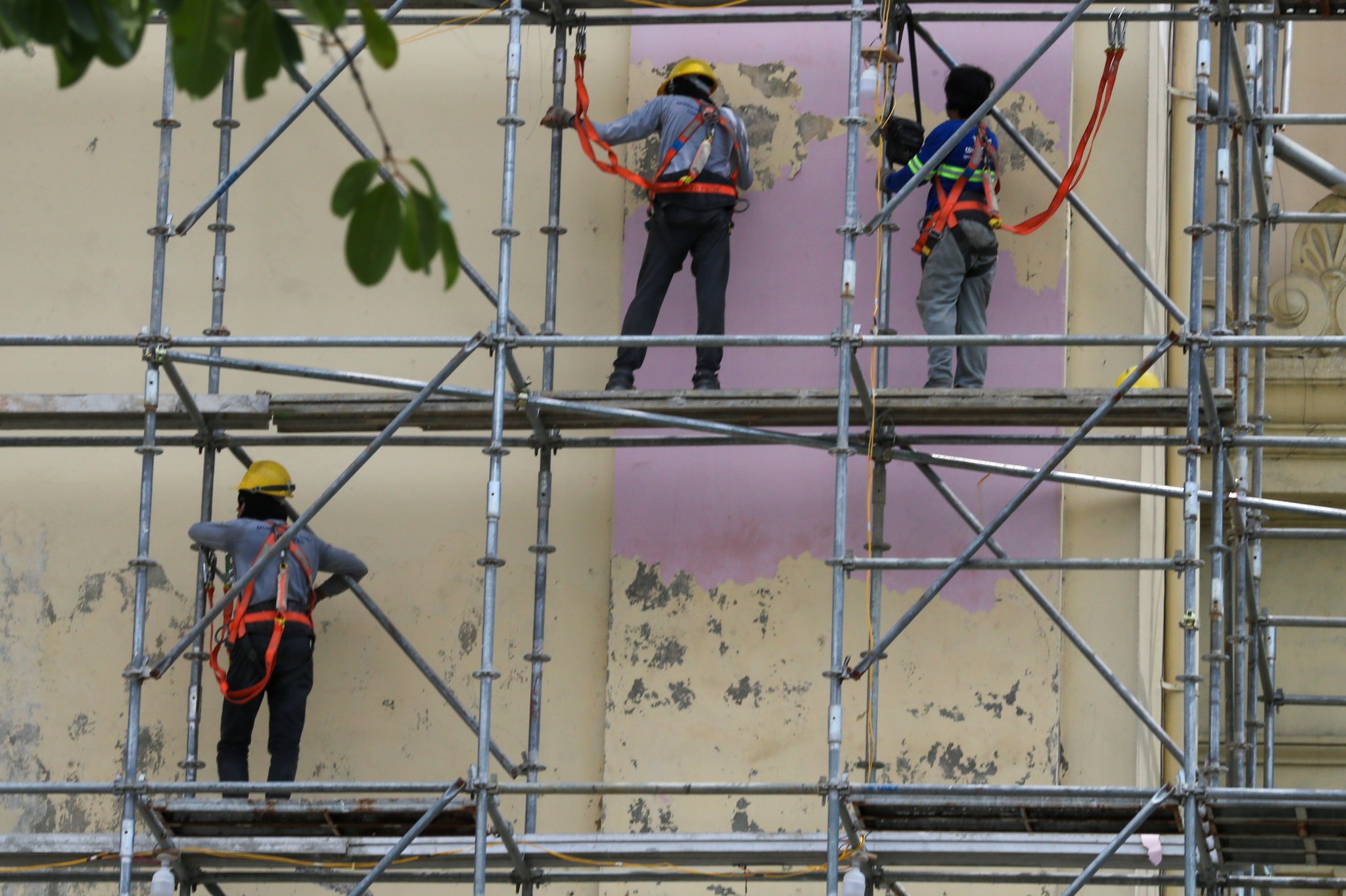 Workers prepare the surface of the Manila Central Post Office Building for its restoration on 02 July 2026, as the Department of Labor and Employment (DOLE) announces an ₱85 increase in the daily minimum wage for workers in Metro Manila—the highest approved wage hike in the region—raising the minimum daily pay from ₱695 to ₱780.