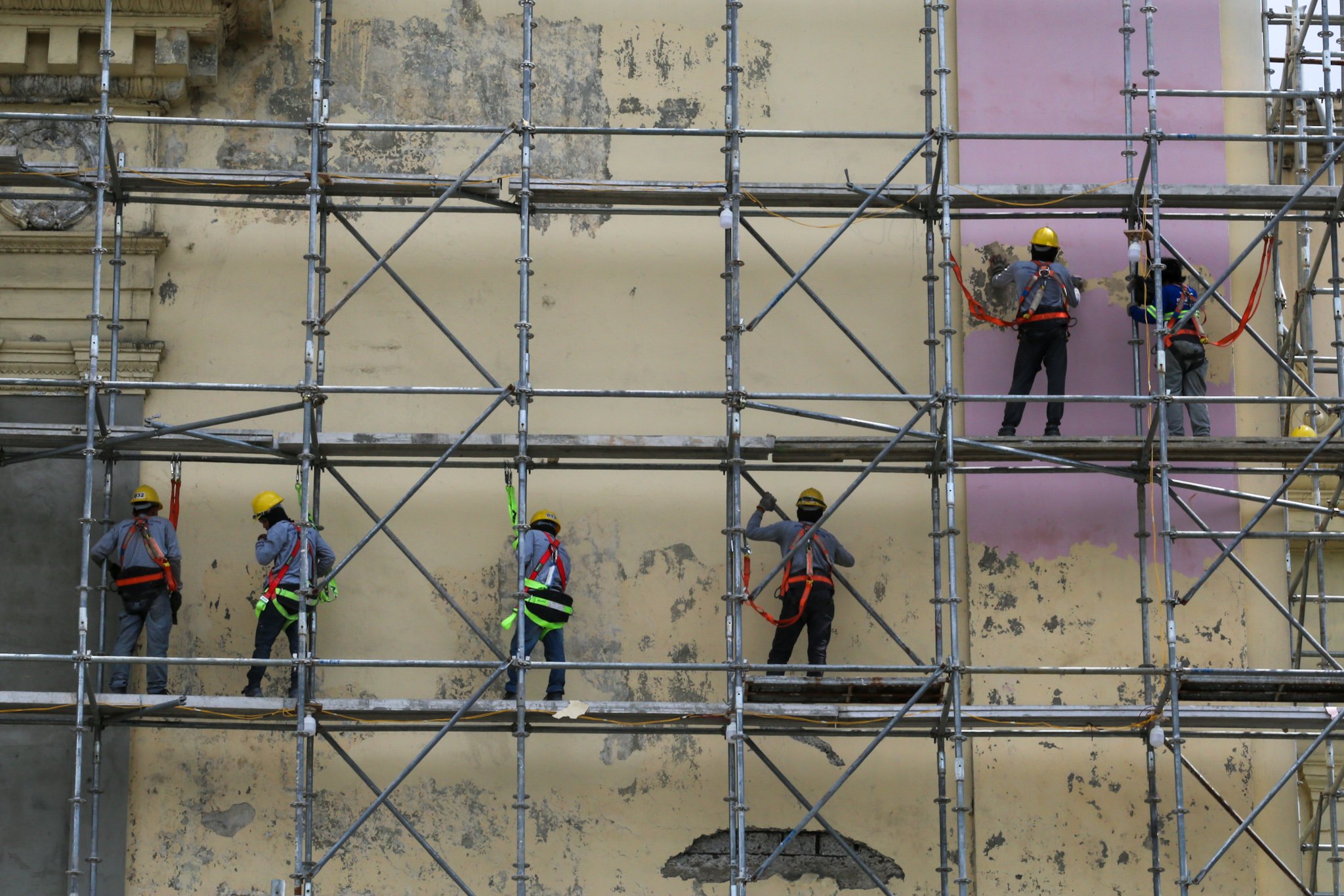 Workers prepare the surface of the Manila Central Post Office Building for its restoration on 02 July 2026, as the Department of Labor and Employment (DOLE) announces an ₱85 increase in the daily minimum wage for workers in Metro Manila—the highest approved wage hike in the region—raising the minimum daily pay from ₱695 to ₱780.