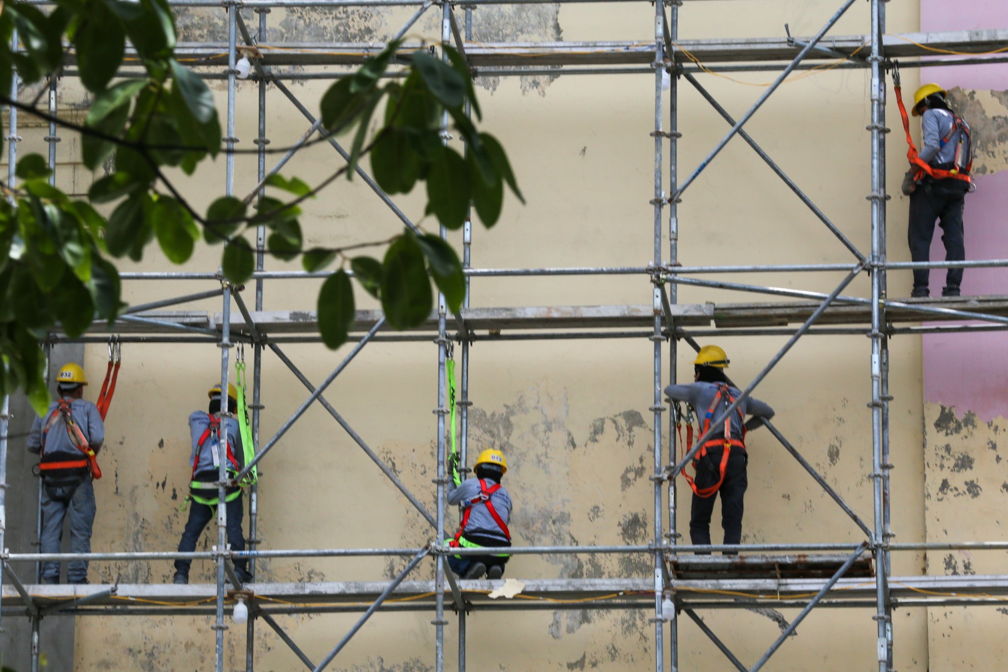 Workers prepare the surface of the Manila Central Post Office Building for its restoration on 02 July 2026, as the Department of Labor and Employment (DOLE) announces an ₱85 increase in the daily minimum wage for workers in Metro Manila—the highest approved wage hike in the region—raising the minimum daily pay from ₱695 to ₱780.