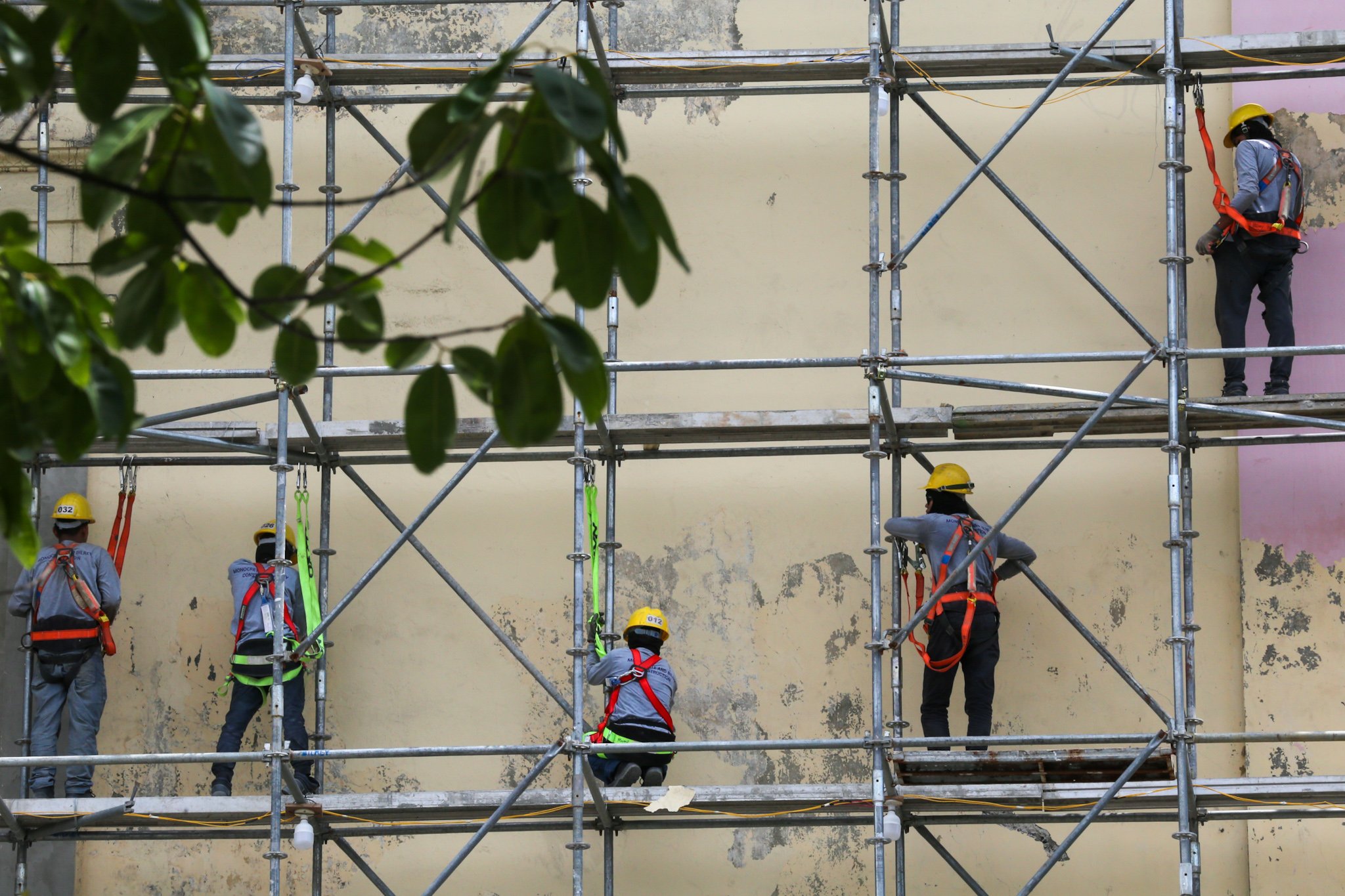 Workers prepare the surface of the Manila Central Post Office Building for its restoration on 02 July 2026, as the Department of Labor and Employment (DOLE) announces an ₱85 increase in the daily minimum wage for workers in Metro Manila—the highest approved wage hike in the region—raising the minimum daily pay from ₱695 to ₱780.
