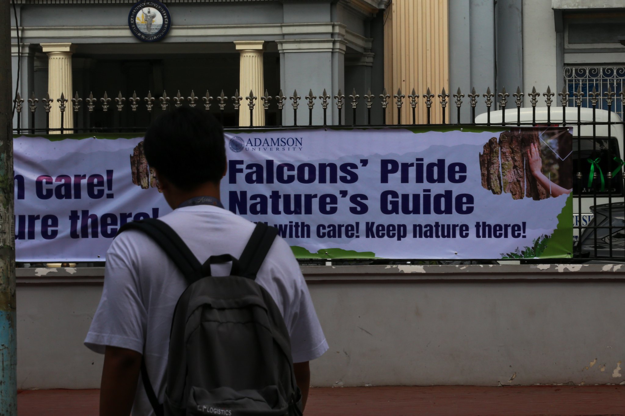 The Adamson University community displays green ribbons on its fences to call for the protection of green spaces and heritage sites and to protest the proposed construction of the Southern Access Link Expressway (SALEX). The community raises concerns over the project's possible impact on the university's campus environment, trees, surrounding community, and historical structures. The university has been designated a historical site by the National Historical Institute.