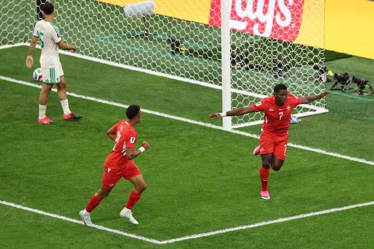 Breel Embolo #7 of Switzerland celebrates scoring his first goal of the tournament