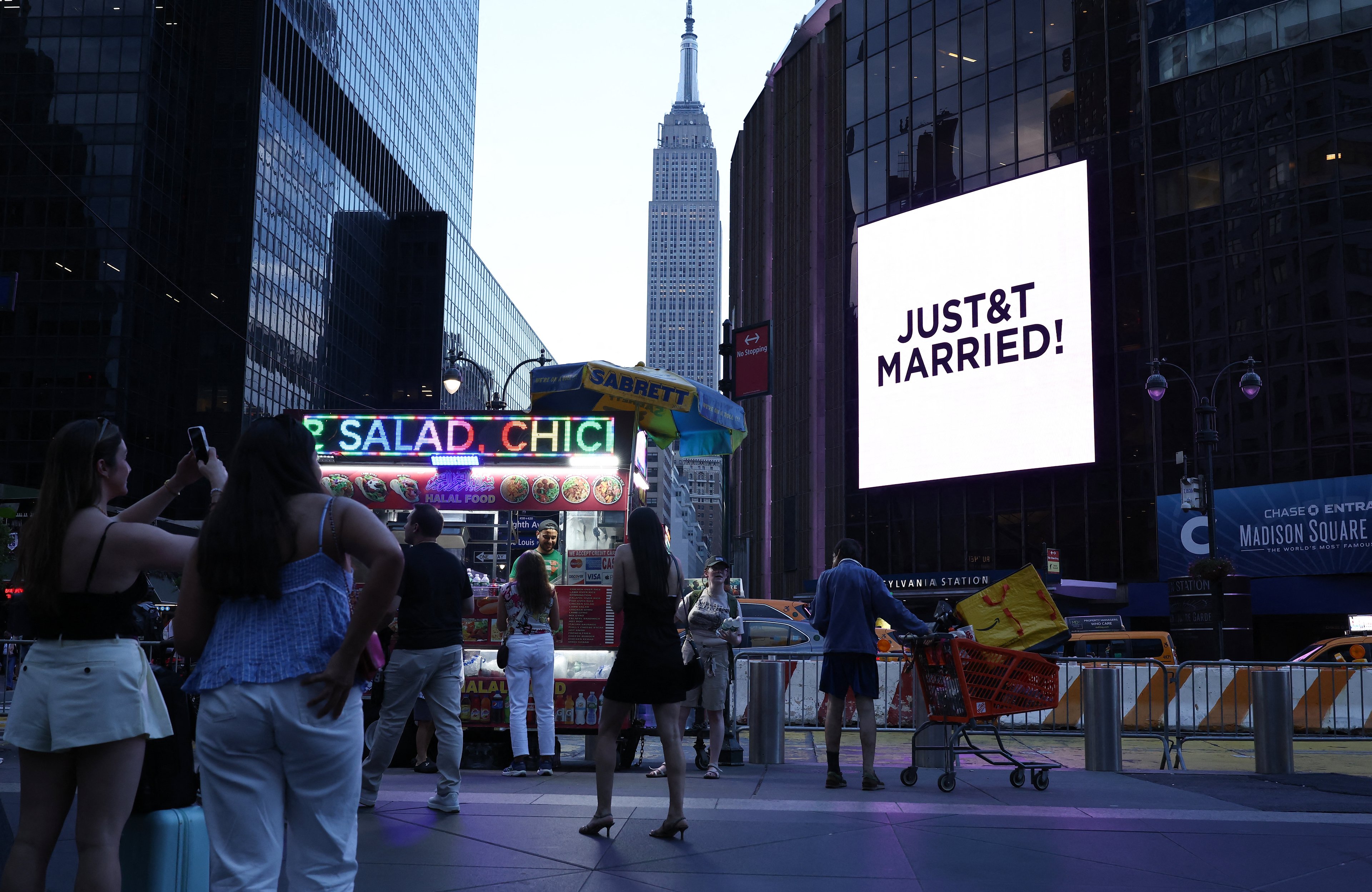 Digital display outside Madison Square Garden announcing the union of Taylor Swift and Travis Kelce.