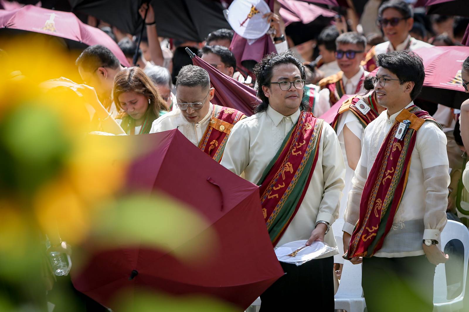 Various progressive graduates staged a protest after the graduation rites ceremony at University of the Philippines Diliman, Quezon City on Sunday, 5 July, 2026. 

Over 5022 students from various degrees celebrated their graduation rites.

Graduates were also seen to strike a pose at the University Avenue of UP Diliman on Sunday, 5 July, 2026 in Quezon City. | Aram Lascano
