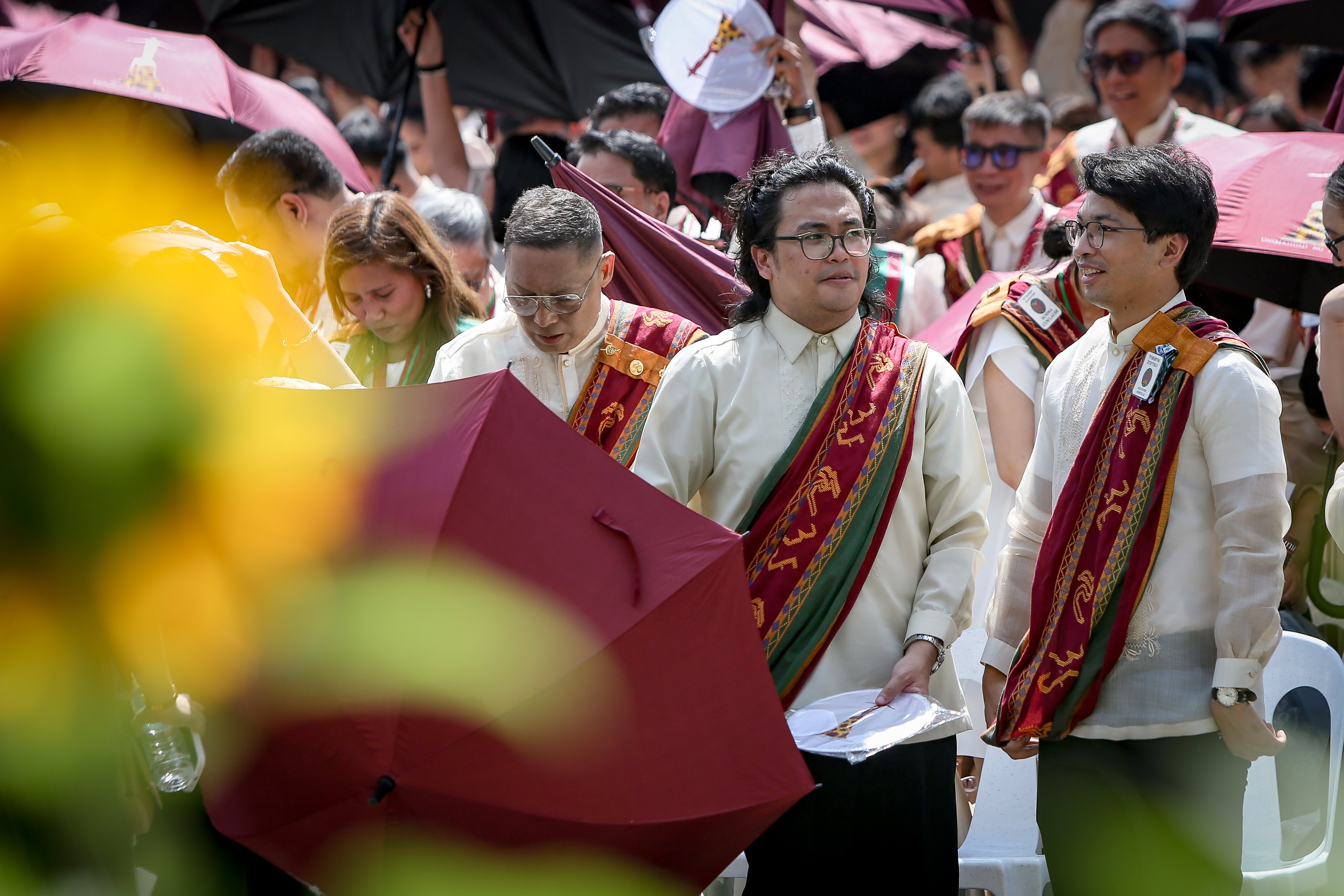 Various progressive graduates staged a protest after the graduation rites ceremony at University of the Philippines Diliman, Quezon City on Sunday, 5 July, 2026. 

Over 5022 students from various degrees celebrated their graduation rites.

Graduates were also seen to strike a pose at the University Avenue of UP Diliman on Sunday, 5 July, 2026 in Quezon City. | Aram Lascano