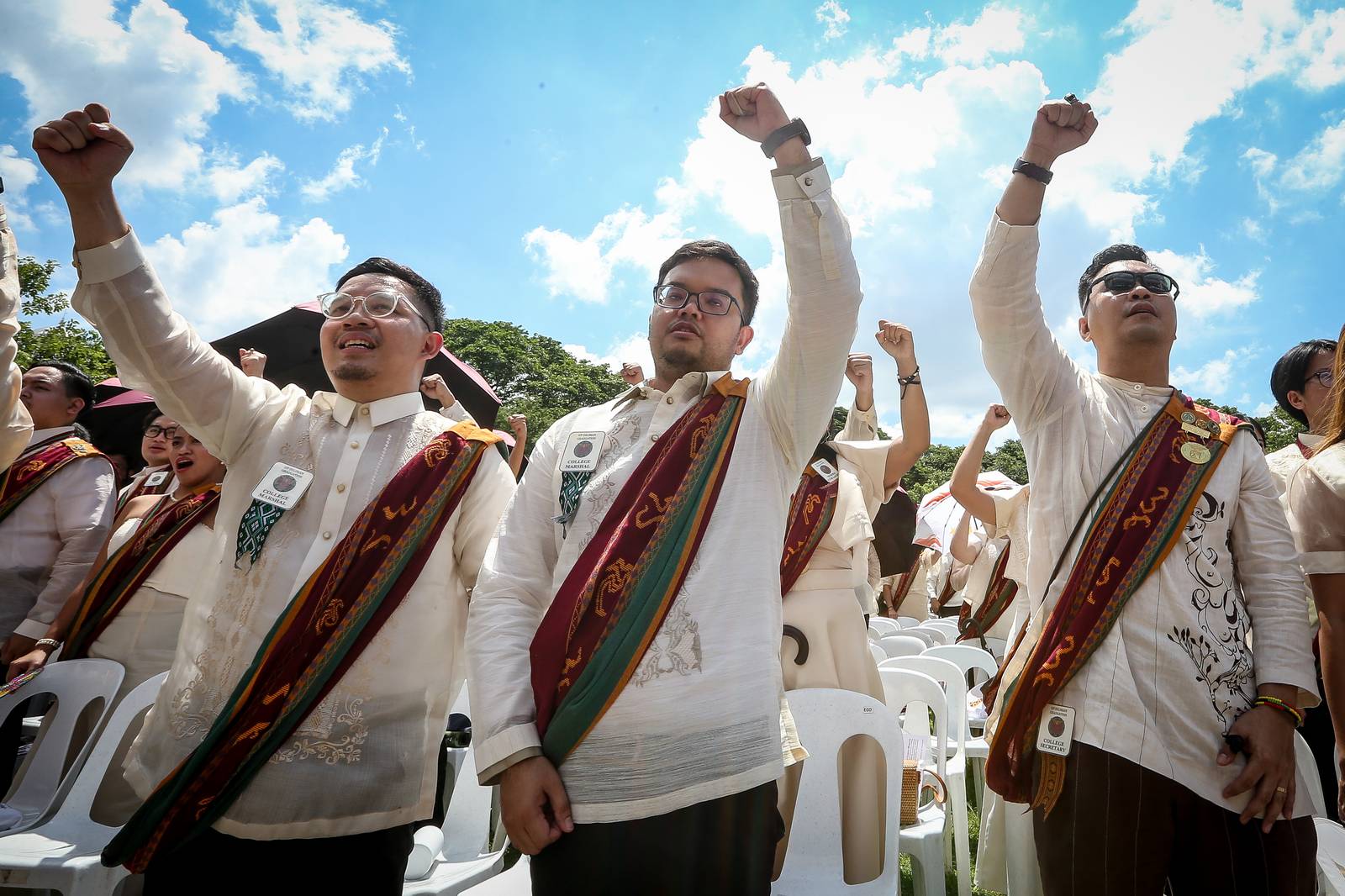 Various progressive graduates staged a protest after the graduation rites ceremony at University of the Philippines Diliman, Quezon City on Sunday, 5 July, 2026. 

Over 5022 students from various degrees celebrated their graduation rites.

Graduates were also seen to strike a pose at the University Avenue of UP Diliman on Sunday, 5 July, 2026 in Quezon City. | Aram Lascano