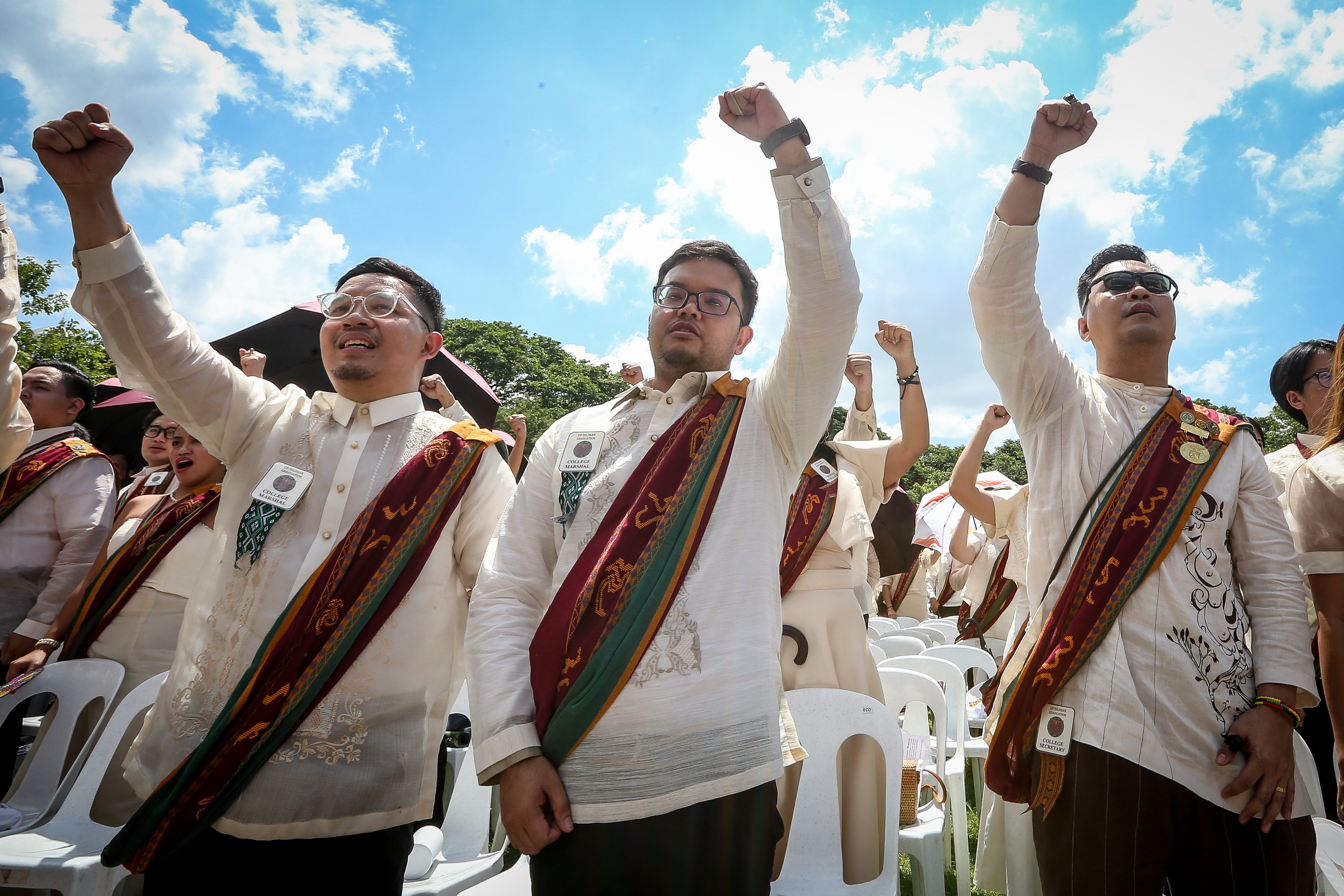 Various progressive graduates staged a protest after the graduation rites ceremony at University of the Philippines Diliman, Quezon City on Sunday, 5 July, 2026. 

Over 5022 students from various degrees celebrated their graduation rites.

Graduates were also seen to strike a pose at the University Avenue of UP Diliman on Sunday, 5 July, 2026 in Quezon City. | Aram Lascano