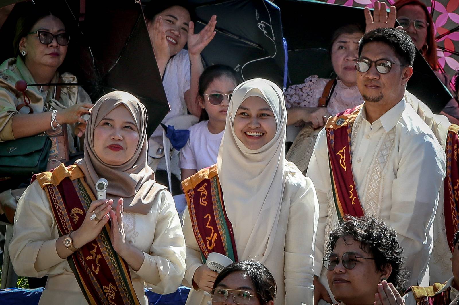 Various progressive graduates staged a protest after the graduation rites ceremony at University of the Philippines Diliman, Quezon City on Sunday, 5 July, 2026. 

Over 5022 students from various degrees celebrated their graduation rites.

Graduates were also seen to strike a pose at the University Avenue of UP Diliman on Sunday, 5 July, 2026 in Quezon City. | Aram Lascano