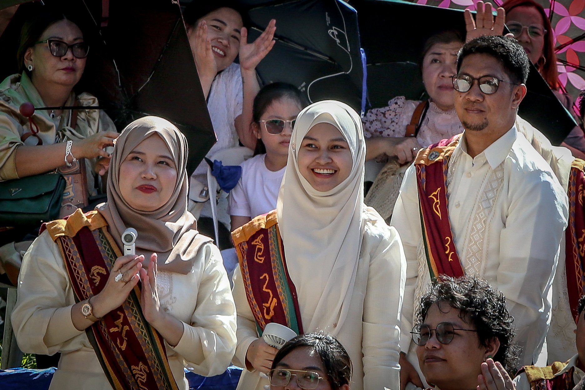 Various progressive graduates staged a protest after the graduation rites ceremony at University of the Philippines Diliman, Quezon City on Sunday, 5 July, 2026. 

Over 5022 students from various degrees celebrated their graduation rites.

Graduates were also seen to strike a pose at the University Avenue of UP Diliman on Sunday, 5 July, 2026 in Quezon City. | Aram Lascano
