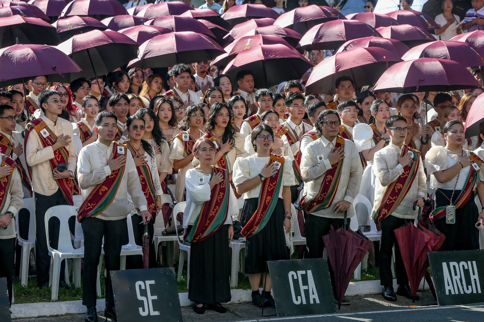 Various progressive graduates staged a protest after the graduation rites ceremony at University of the Philippines Diliman, Quezon City on Sunday, 5 July, 2026. 

Over 5022 students from various degrees celebrated their graduation rites.

Graduates were also seen to strike a pose at the University Avenue of UP Diliman on Sunday, 5 July, 2026 in Quezon City. | Aram Lascano
