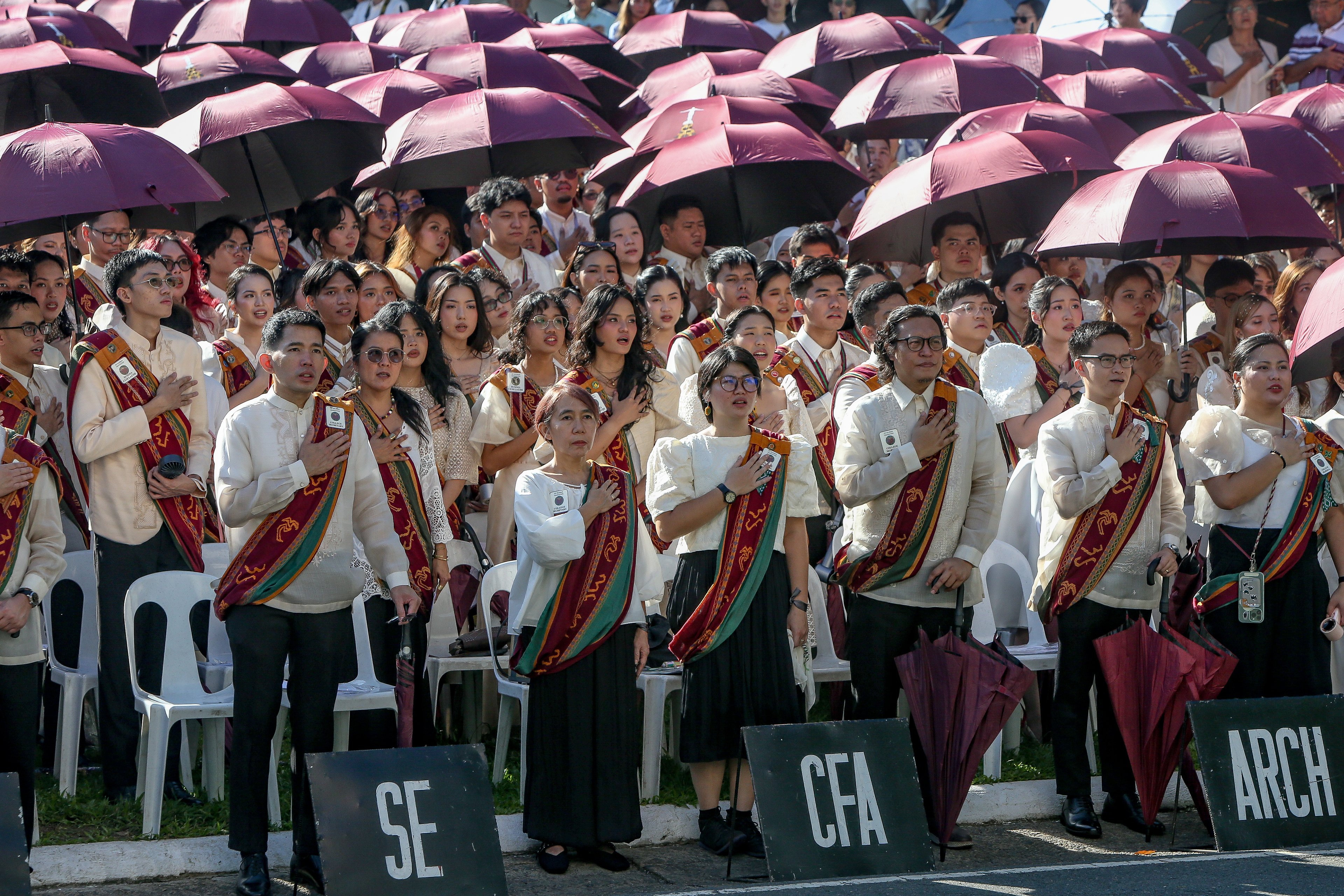 Various progressive graduates staged a protest after the graduation rites ceremony at University of the Philippines Diliman, Quezon City on Sunday, 5 July, 2026. 

Over 5022 students from various degrees celebrated their graduation rites.

Graduates were also seen to strike a pose at the University Avenue of UP Diliman on Sunday, 5 July, 2026 in Quezon City. | Aram Lascano