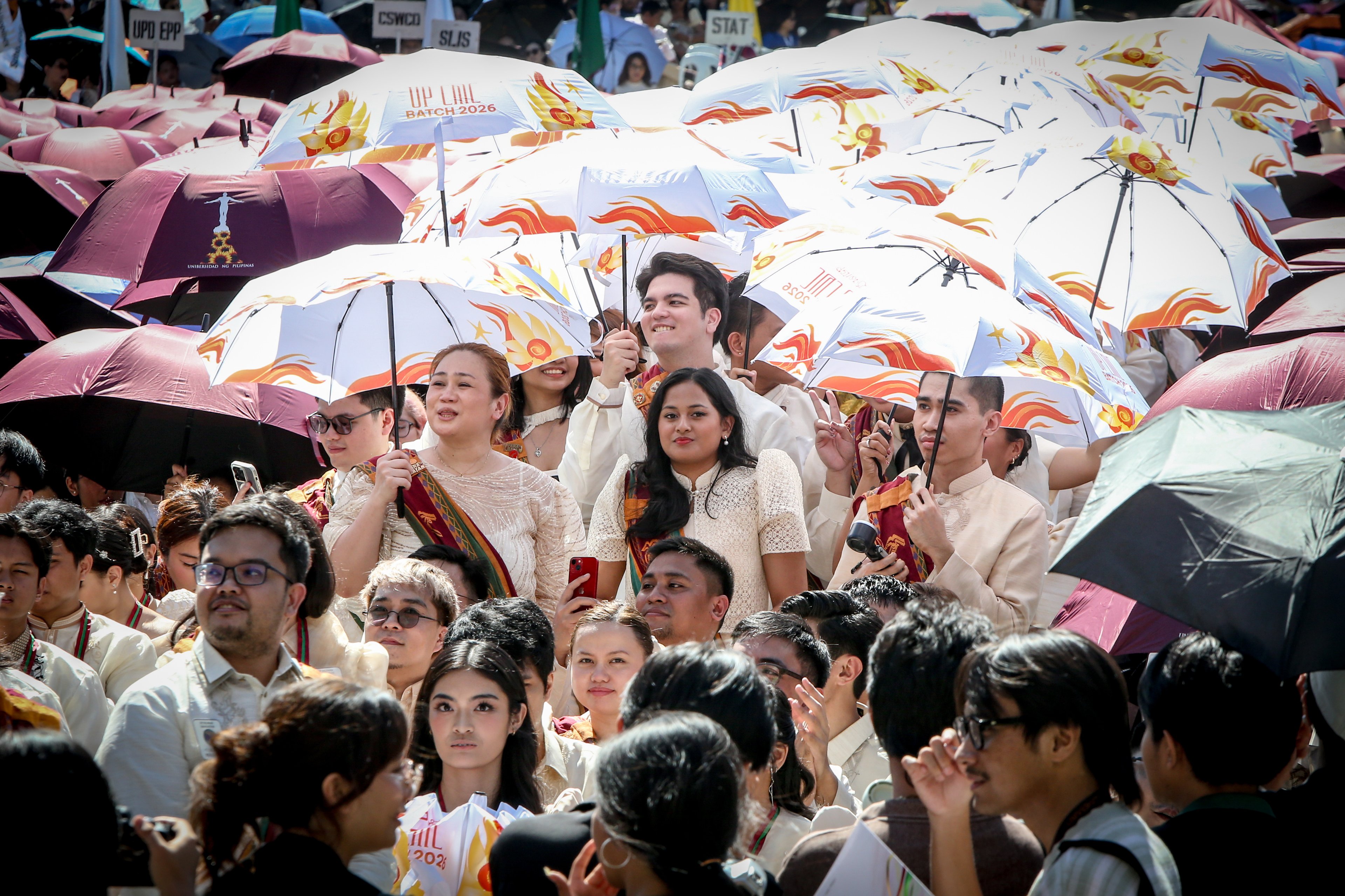 Various progressive graduates staged a protest after the graduation rites ceremony at University of the Philippines Diliman, Quezon City on Sunday, 5 July, 2026. 

Over 5022 students from various degrees celebrated their graduation rites.

Graduates were also seen to strike a pose at the University Avenue of UP Diliman on Sunday, 5 July, 2026 in Quezon City. | Aram Lascano