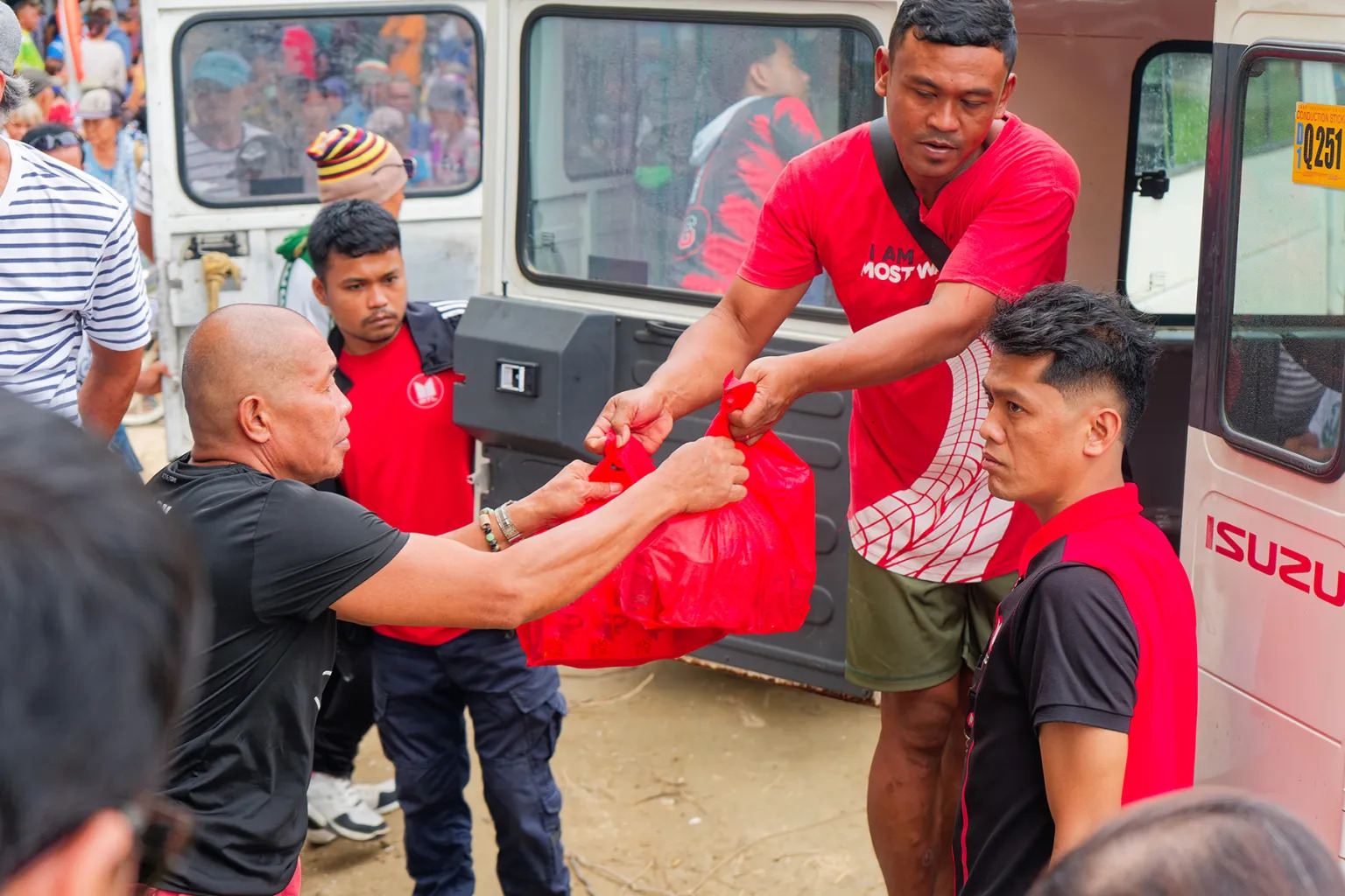 RELIEF packs are handed over to residents of Barangay Burias in Sarangani after the earthquake disrupted homes, roads and access to basic supplies.