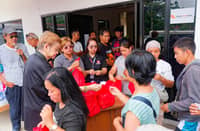 FAMILIES in Barangay Burias receive aid from Isuzu Philippines Corporation, Isuzu General Santos and local officials as the community recovers from the Glan earthquake.