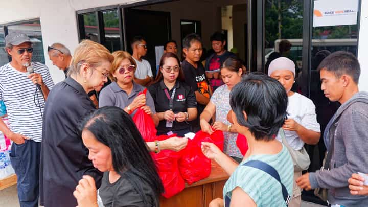 FAMILIES in Barangay Burias receive aid from Isuzu Philippines Corporation, Isuzu General Santos and local officials as the community recovers from the Glan earthquake.