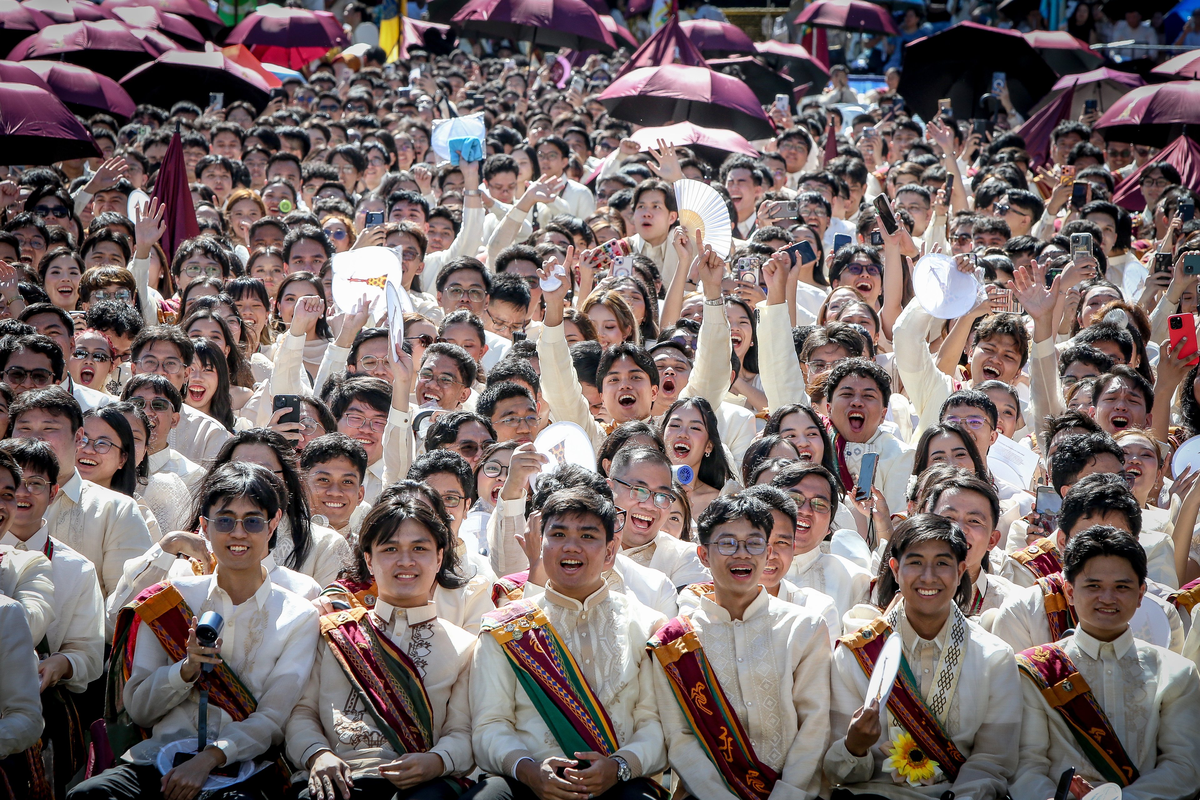 Various progressive graduates staged a protest after the graduation rites ceremony at University of the Philippines Diliman, Quezon City on Sunday, 5 July, 2026. 

Over 5022 students from various degrees celebrated their graduation rites.

Graduates were also seen to strike a pose at the University Avenue of UP Diliman on Sunday, 5 July, 2026 in Quezon City. | Aram Lascano