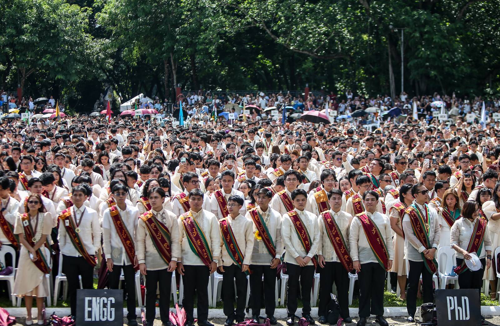 Various progressive graduates staged a protest after the graduation rites ceremony at University of the Philippines Diliman, Quezon City on Sunday, 5 July, 2026. 

Over 5022 students from various degrees celebrated their graduation rites.

Graduates were also seen to strike a pose at the University Avenue of UP Diliman on Sunday, 5 July, 2026 in Quezon City. | Aram Lascano