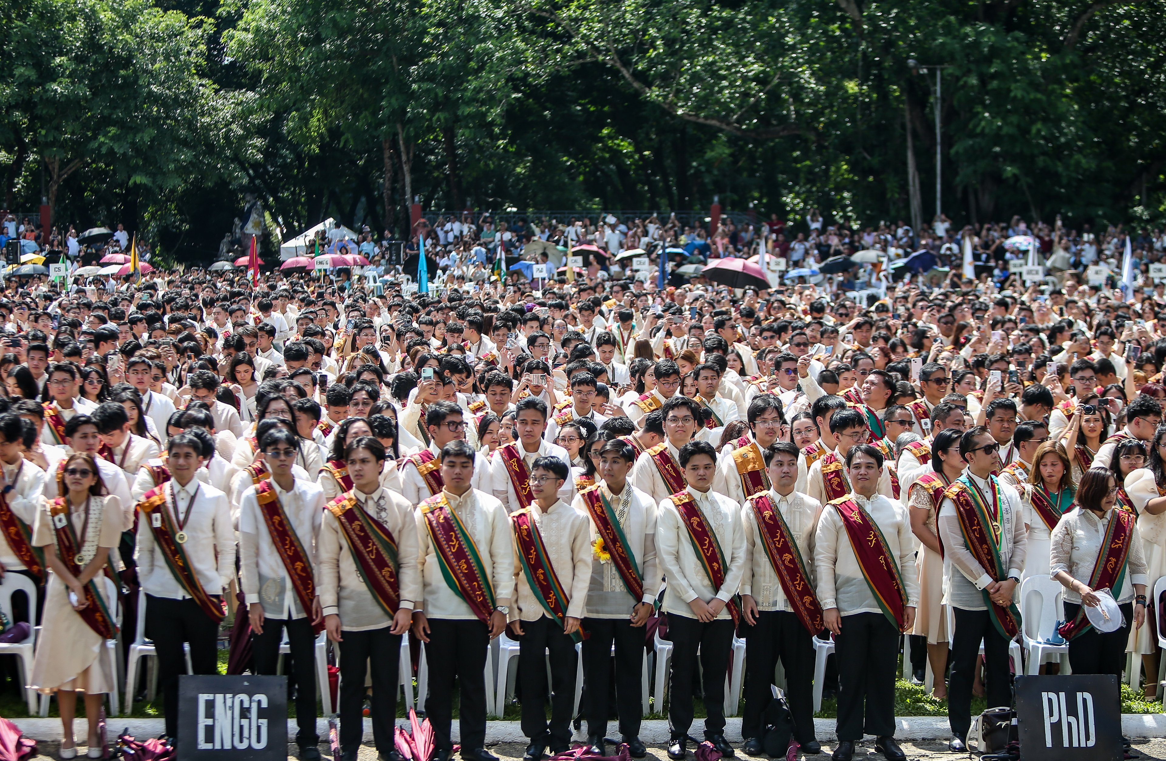 Various progressive graduates staged a protest after the graduation rites ceremony at University of the Philippines Diliman, Quezon City on Sunday, 5 July, 2026. 

Over 5022 students from various degrees celebrated their graduation rites.

Graduates were also seen to strike a pose at the University Avenue of UP Diliman on Sunday, 5 July, 2026 in Quezon City. | Aram Lascano
