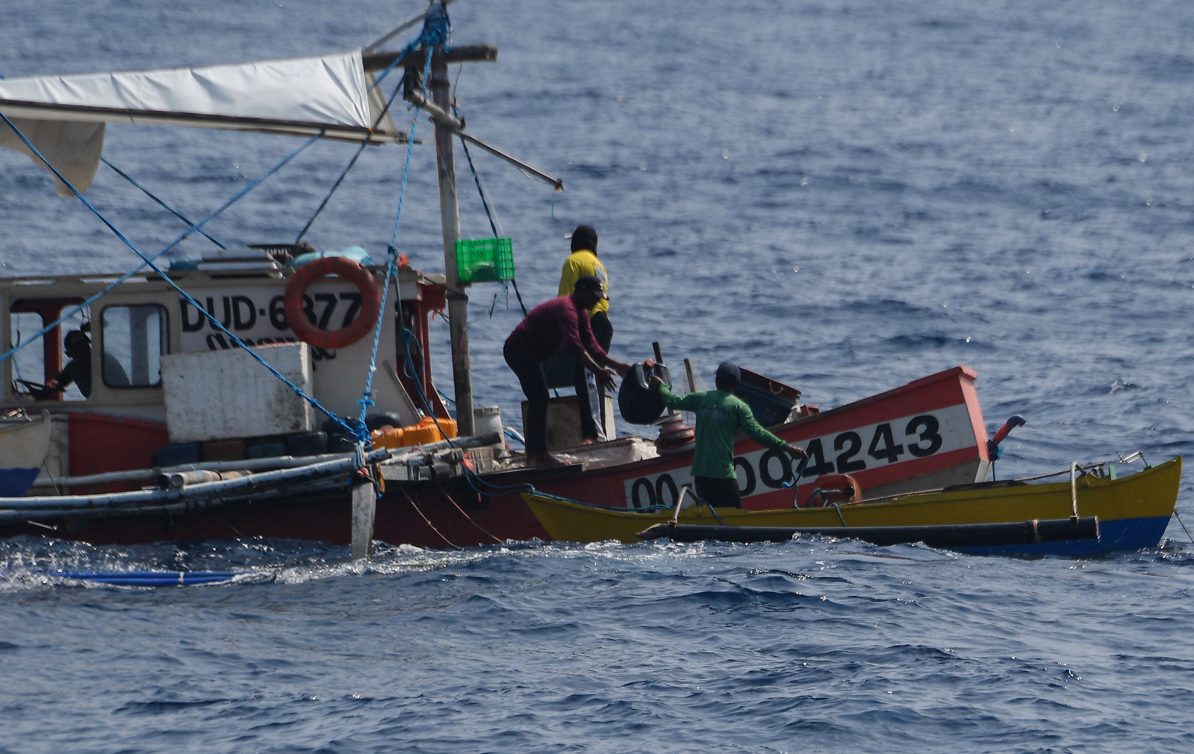 China patrols surge; fishermen push back
