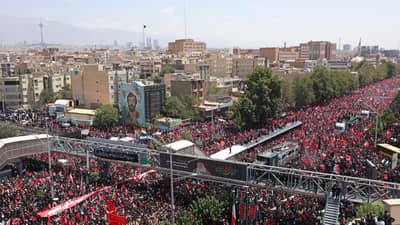 PEOPLE gather along a street during the funeral procession of Iran’s late supreme leader Ali Khamenei and his family members, in Tehran on 6 July 2026.