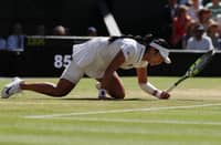 ALEX Eala tumbles to the grass while chasing down a shot during her women's singles Round of 16 clash against Italy's Jasmine Paolini on the eighth day of the 2026 Wimbledon Championships at the All England Lawn Tennis and Croquet Club in Wimbledon, southwest London, on Monday. The fall captured the grit and determination of the young Filipina, who fought until the final point in her historic Wimbledon campaign.